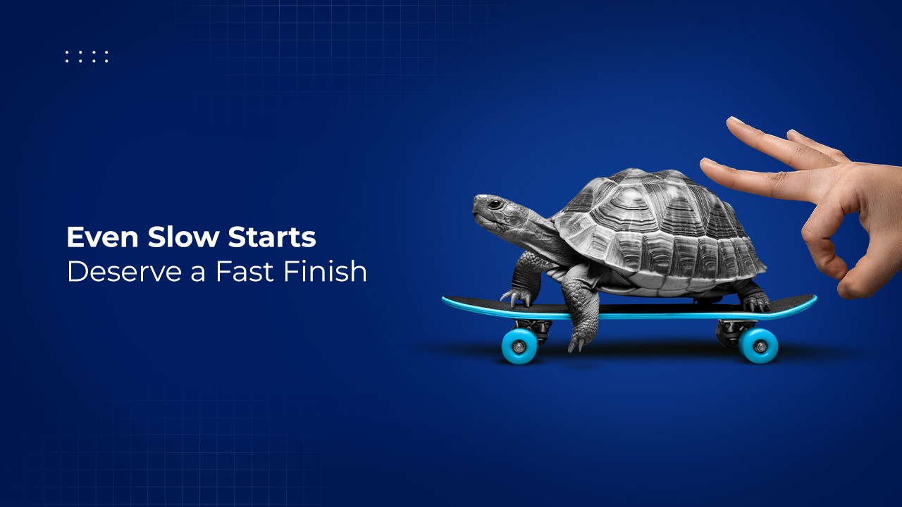 A creative marketing visual featuring a turtle riding a blue skateboard on a dark blue gradient background. A human hand beside it is posed as if flicking or propelling the turtle forward. The text on the left reads, “Even Slow Starts Deserve a Fast Finish” in bold white and light blue typography. The image symbolizes acceleration, progress, and growth despite slow beginnings.